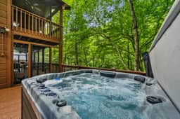 Riverfront Cabin: Hot Tub, Sauna, Arcade & Views - Image 4
